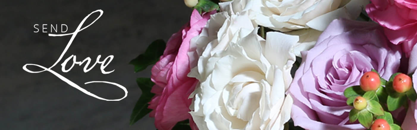 An elegant wedding ceremony aisle lined with florals